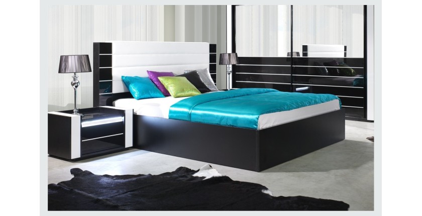 Lit double 160 cm avec option coffre LINA. Coloris noir et blanc brillant avec une finition en simili cuir. Sommier inclus