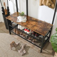 Portemanteau collection RICHMOND coloris noir et bois. Meuble d'entrée avec penderie et rangement chaussures intégrés